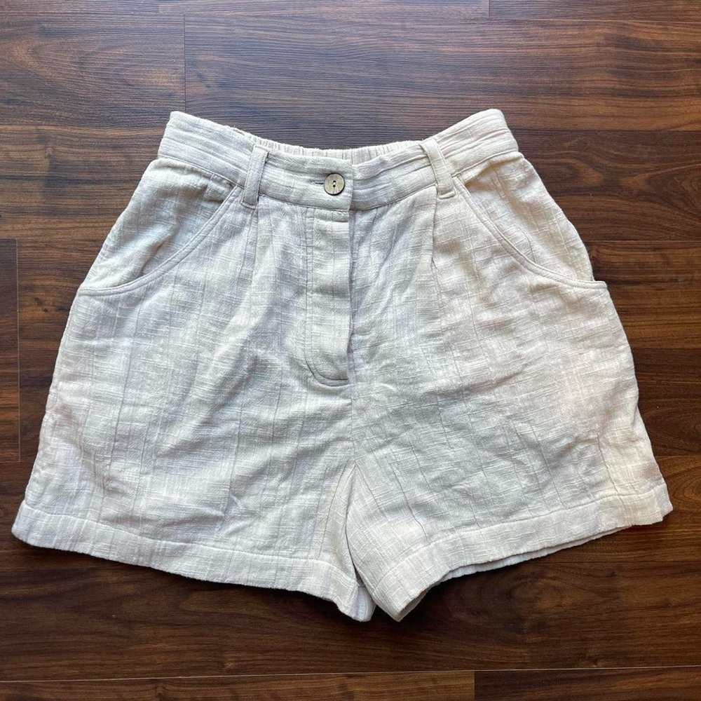 Beige Free People shorts.
